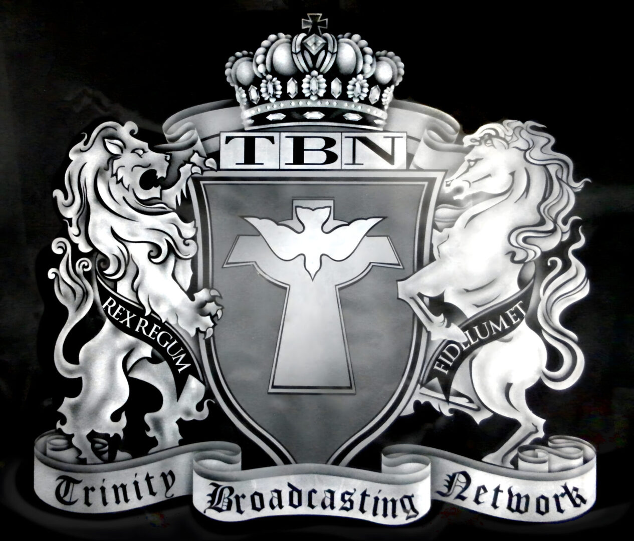 Emblem of trinity broadcasting network featuring a crowned shield with a cross, flanked by two lions and inscribed ribbons.