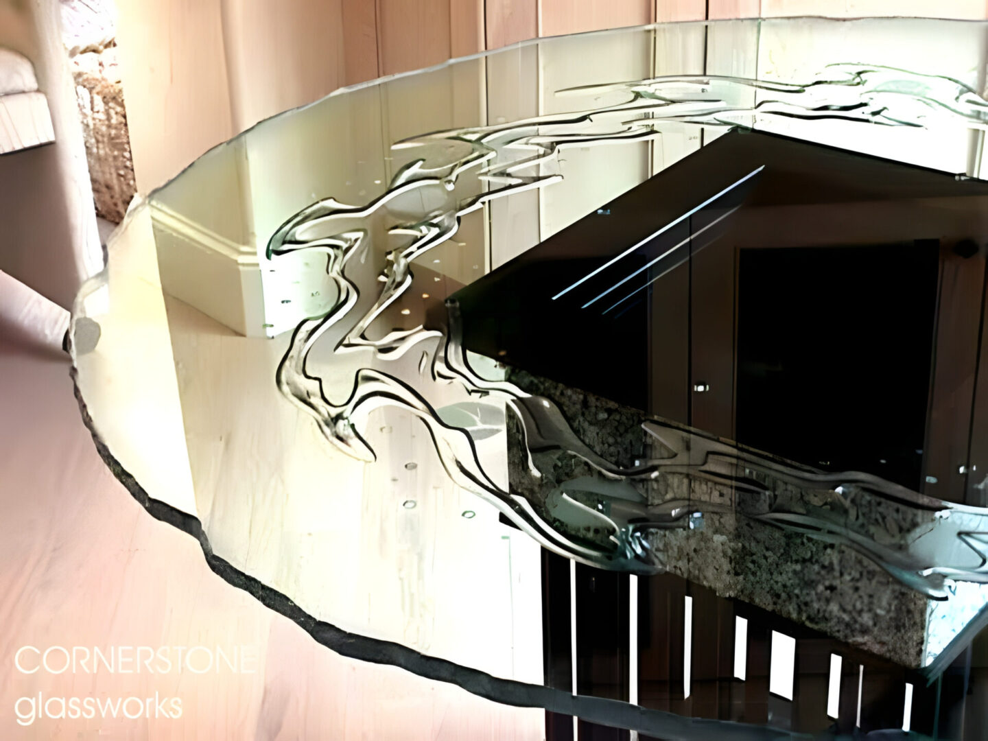 Elegant glass countertop with abstract design over a kitchen island.