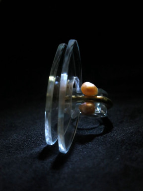 A spinning top in motion on a dark background.