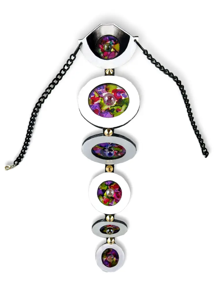 A contemporary wall hanging featuring an abstract design with colorful elements inside circular frames connected by chains.